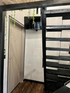 a room with a sliding door and a garage at A corner by the sea in Ashdod