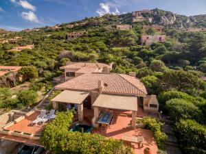 an aerial view of a house with a mountain at Li Junchi in Costa Paradiso +11 photos