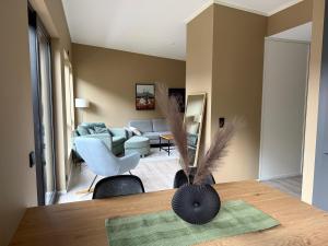 a living room with a couch and a table at Aurora Apartments - Stryn View in Stryn
