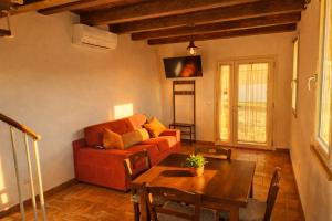 a living room with a couch and a table at Nazem Holiday in Comunanza