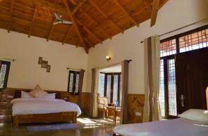 a bedroom with two beds in a room at Voyager stone cottage in Bhīm Tāl