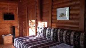 a couch sitting in a room with a window at Sakin Vadi Winehouse in Orhaniye