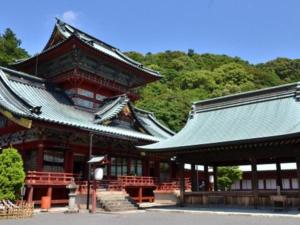 an asian building with a green roof with trees at Shizuoka Town Hotel in Shizuoka