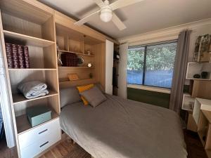 a small bedroom with a bed and a window at Cosy and Pet Friendly Blackheath Studio 2 in Blackheath