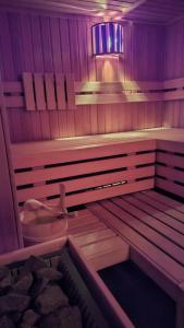 a sauna with purple lights on the inside of it at Hotel & Wellness Fra I Pini in Lignano Sabbiadoro
