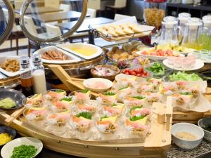a buffet with many different types of food on a table at Shizutetsu Hotel Prezio Numazu in Numazu