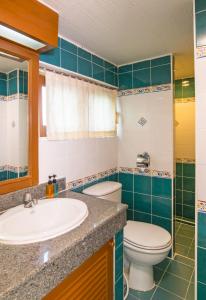 a bathroom with a sink and a toilet at Krabi City Seaview Hotel in Krabi town