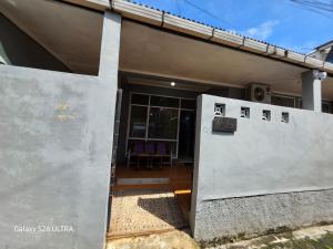 an open door of a house with a patio at Omah Diaz Homestay Malioboro in Jetis