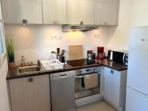 a kitchen with a sink and a counter top at Le Cocon de Clisson in Clisson