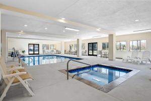 a large swimming pool in a house at Super 8 by Wyndham Montpelier - Bear Lake in Montpelier