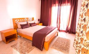 Postel nebo postele na pokoji v ubytování Mahdia Place Apartments