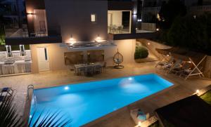 an overhead view of a swimming pool at night at Allas Villa Heated Pool in Chania
