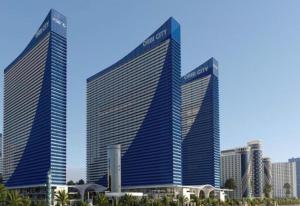 two tall buildings in front of a city at Orbi in Batumi 24 in Angisa