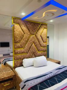 a bed with two pillows in a room at Double Homes in Agbelekale