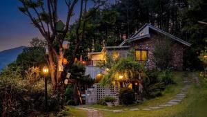 a house with a pathway leading to it at night at Yangyang Little Forest Pension in Yangyang +10 photos
