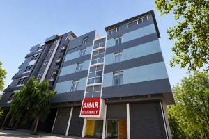 a building with a sign in front of it at FabHotel Amar Residency, Sector 7, Dwarka in New Delhi