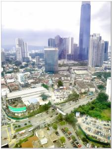 an aerial view of a city with tall buildings at Concord service suite time square in Kuala Lumpur