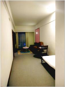 a living room with a couch and a table at Concord service suite time square in Kuala Lumpur +72 photos