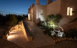 a staircase leading to a house at night at Allas Villa Heated Pool in Chania