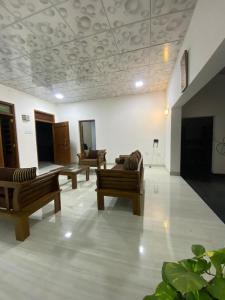 a living room with couches and a pool table at Beloved Regency Homestay in Kandy