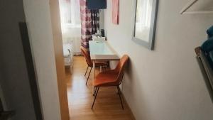 a small dining room with a table and chairs at u Bozeny pokoje in Dźwirzyno