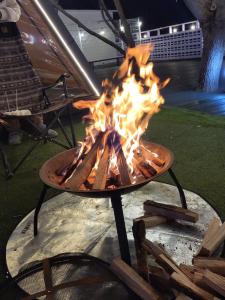a fire pit with flames on a table at Cheongdo Provence Glamping in Cheongdo