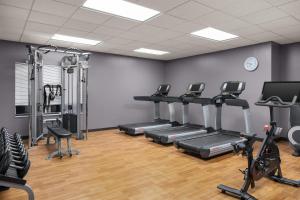 a gym with treadmills and elliptical machines at Hyatt House Fishkill-Poughkeepsie in Fishkill