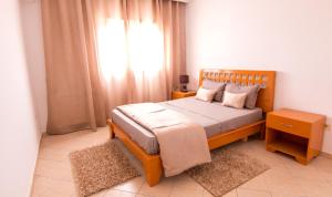 Postel nebo postele na pokoji v ubytování Mahdia Place Apartments