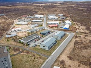 an aerial view of a building complex with a road at Deluxe Family Apartment in Egilsstaðir in Egilsstaðir