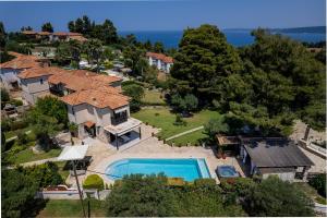 an aerial view of a house with a swimming pool at Eco Stone Villa with Private Pool and Jacuzzi in Kalandra