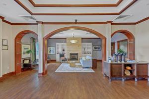a living room with an archway and a living room at Country Inn & Suites by Radisson, Braselton, GA in Braselton