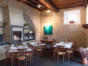 a restaurant with tables and chairs in a room at La Sosta di Ottone III in Levanto