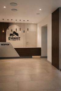 an office lobby with a reception desk and a sign at Everest in Zyryanovsk
