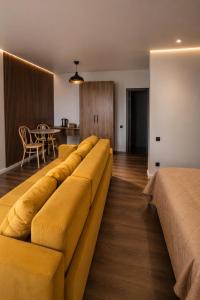 a large couch in a living room with a table at Everest in Zyryanovsk