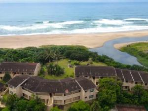 an aerial view of a resort near the beach at 35 Ocean Breeze Winkelspruit in Kingsborough