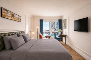 a hotel room with a large bed and a window at M Village Hotel Long Biên, a brand of Modern Village Lifestyle in Hanoi