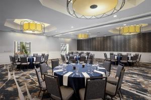 a conference room with tables and chairs and a stage at DoubleTree by Hilton Hotel Philadelphia Center City in Philadelphia