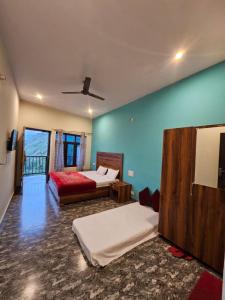 a bedroom with two beds in a room at Sai Homestay in Mussoorie