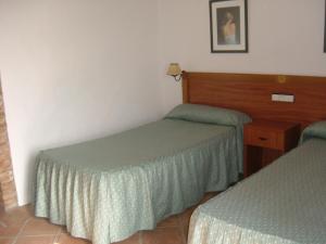 Postel nebo postele na pokoji v ubytování Hotel Rural Casares