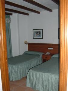 Postel nebo postele na pokoji v ubytování Hotel Rural Casares