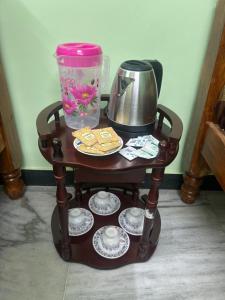 a table with a coffee maker and a container on it at CR Private Villa in Tiruvannāmalai