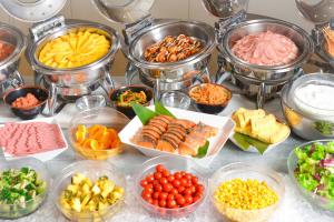 a table topped with bowls of different types of food at Cross Wave Umeda in Osaka +66 photos