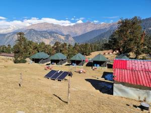 a group of tents with solar panels in a field at grand holiday camp in Sari