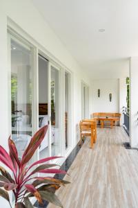 a living room with a bench and a table at THE SANDS LOMBOK in Mangsit