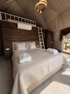 a bedroom with a bed in a tent at GSpace in Yaremche +92 photos