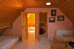 a living room with a door open to a bedroom at Bringatanya in Balatonkenese