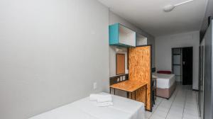 a room with two beds and a room with a bedroom at Seaboard Apart Hotel in Durban