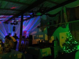 a room with a christmas tree in a room with lights at StaroplaninSki Apartments in Crni Vrh