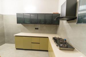 a kitchen with a stove and a counter top at Casa Mog by Meraden in Vagator