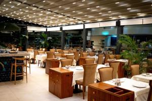 a dining room with tables and chairs in a restaurant at Grand Galata Hotel & Spa in Istanbul